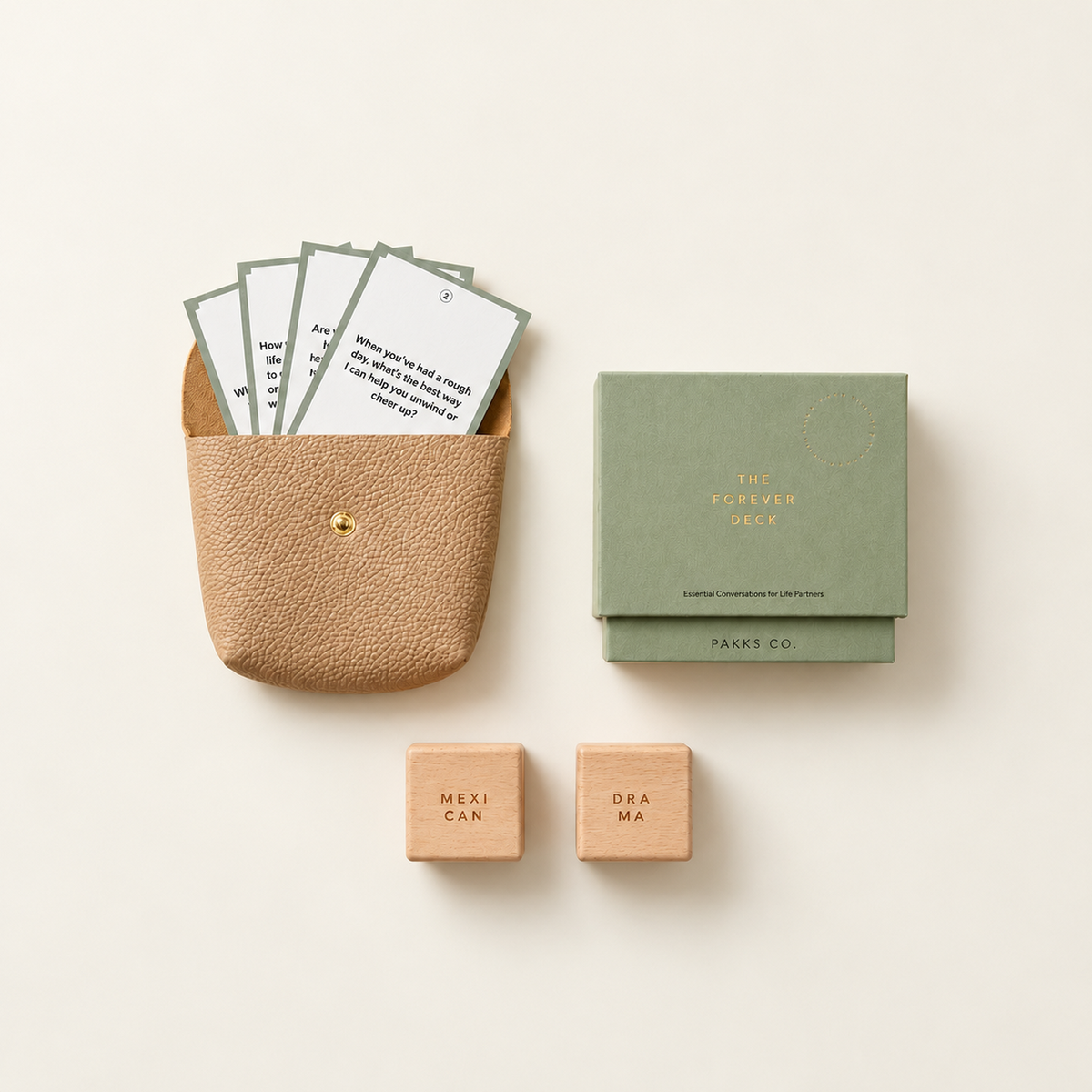 The Mini Pakk: the Forever Deck box, a tan vegan leather Travel Pouch holding cards and two wooden Decision Dice