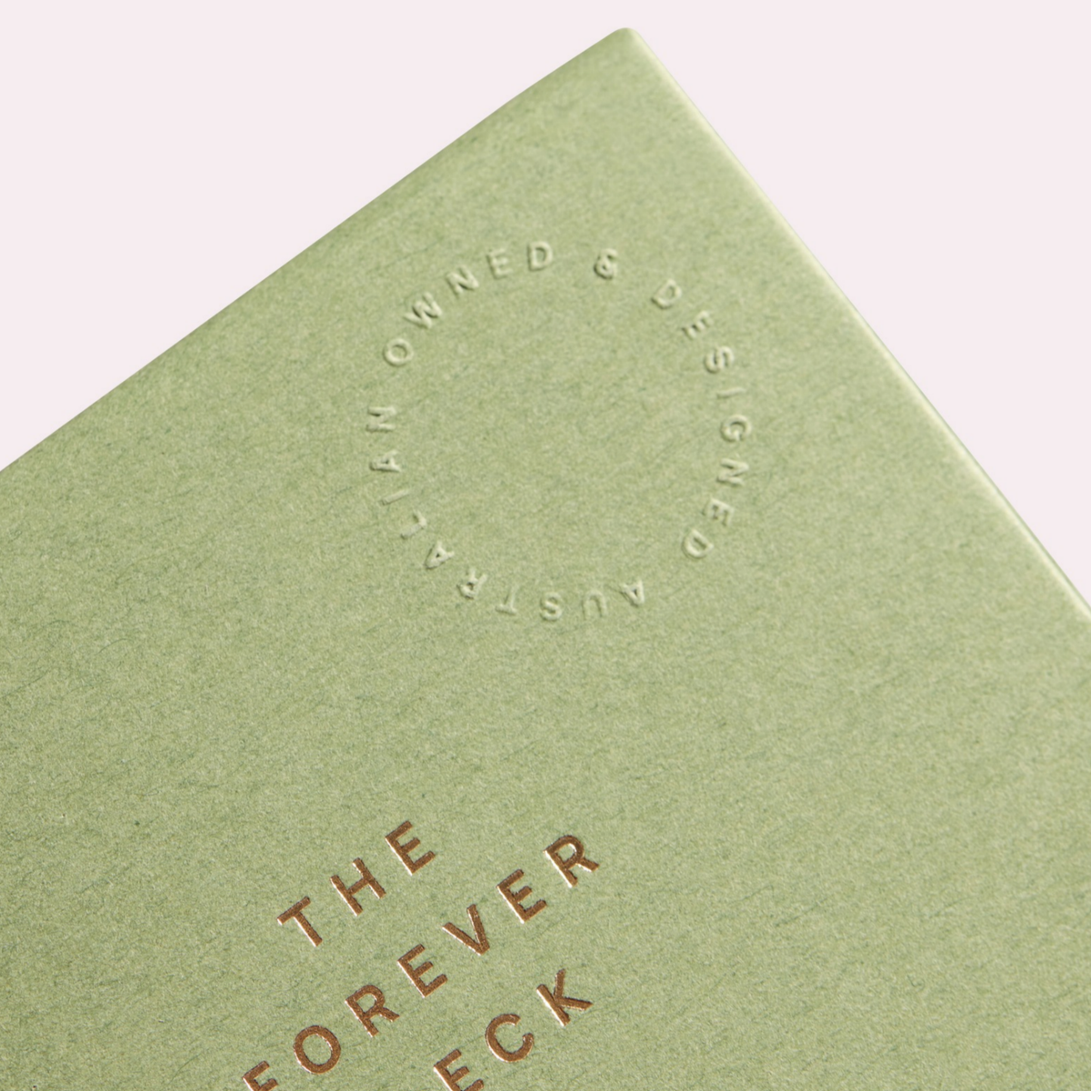 Close-up of the Forever Deck lid with copper foil lettering and an embossed "Australian owned & designed" seal