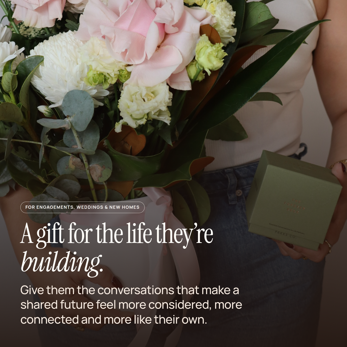 Someone holding a flower bouquet and the Forever Deck box, captioned "A gift for the life they're building."