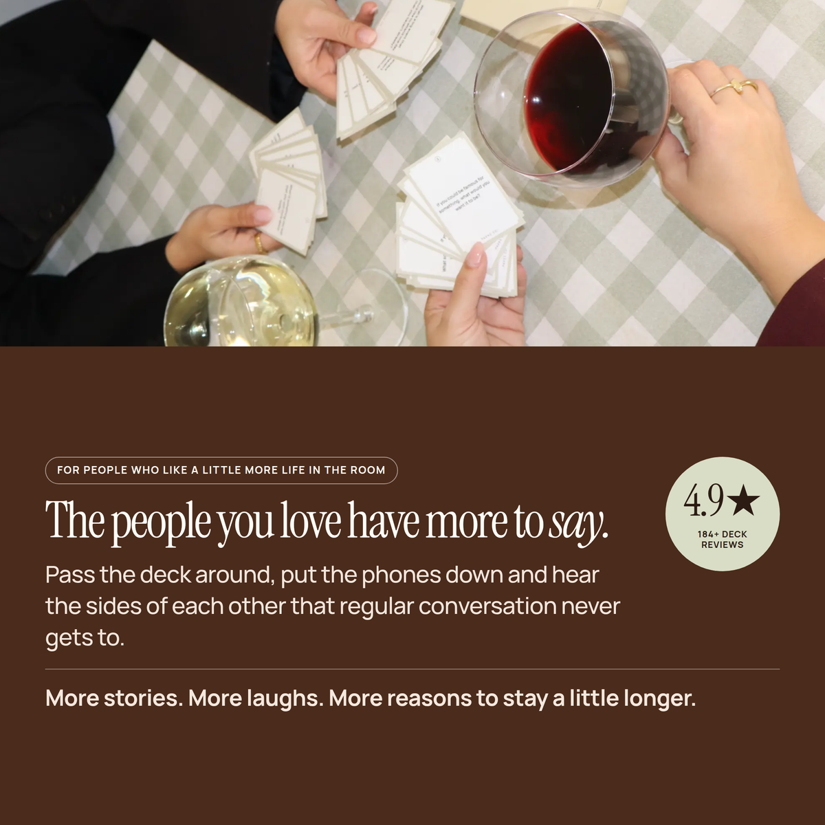 Friends sharing Laughter cards over wine, above the line "The people you love have more to say."